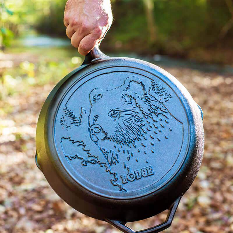 Lodge 12" Wildlife Series Cast Iron Skillet with Bear design, available at Cabin Depot, for cooking exquisite meals at home.