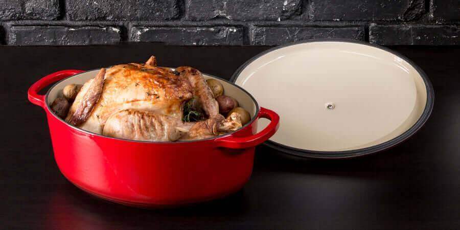 Red Lodge 7 Quart Enameled Cast Iron Dutch Oven with roasted chicken and vegetables.