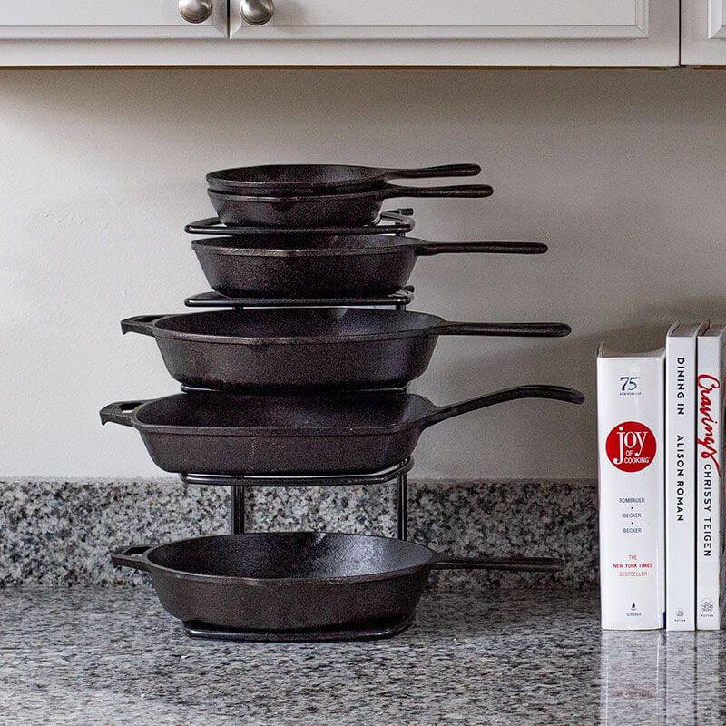 Lodge cookware organizer with 5-tier all-steel construction holding cast iron pans on countertop, available at Cabin Depot.