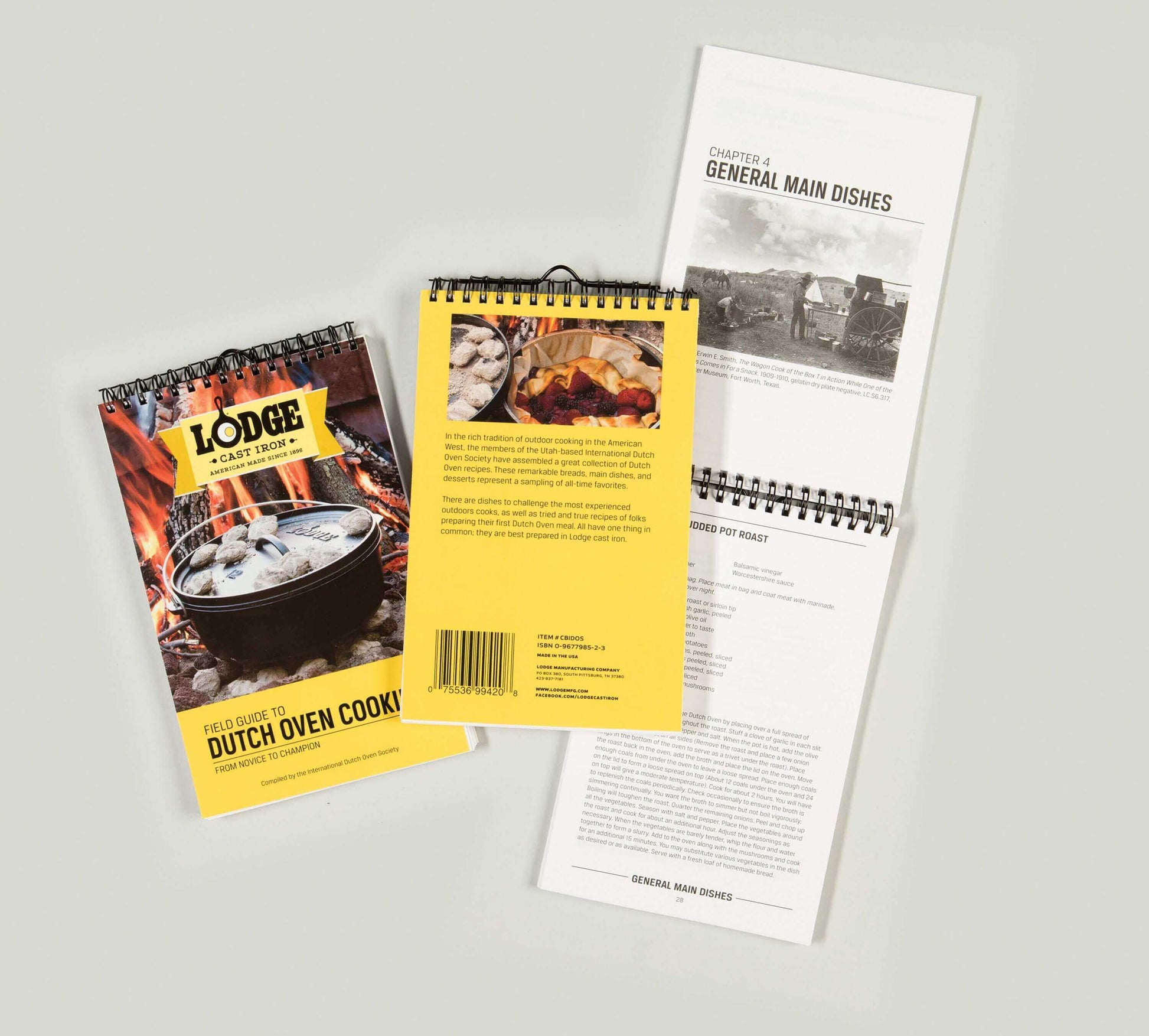 Lodge Field Guide to Dutch Oven Cooking cookbook with spiral binding, featuring recipes and tips from the International Dutch Oven Society at Cabin Depot.
