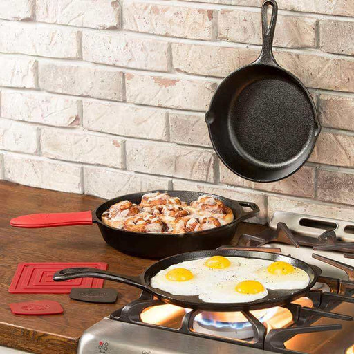 Lodge Skillet Set 6 Piece with eggs and cinnamon rolls, showcasing seasoned cast iron cookware on a kitchen stove.