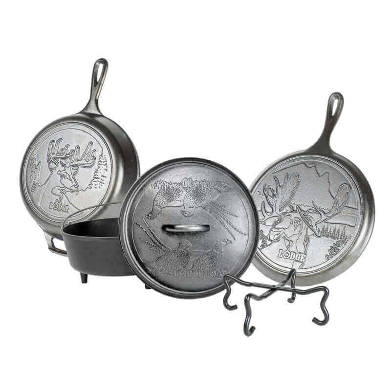 Lodge Wildlife Series 5-Piece Cast Iron Cookware Set with wildlife designs, available at Cabin Depot, includes Dutch oven and skillets.