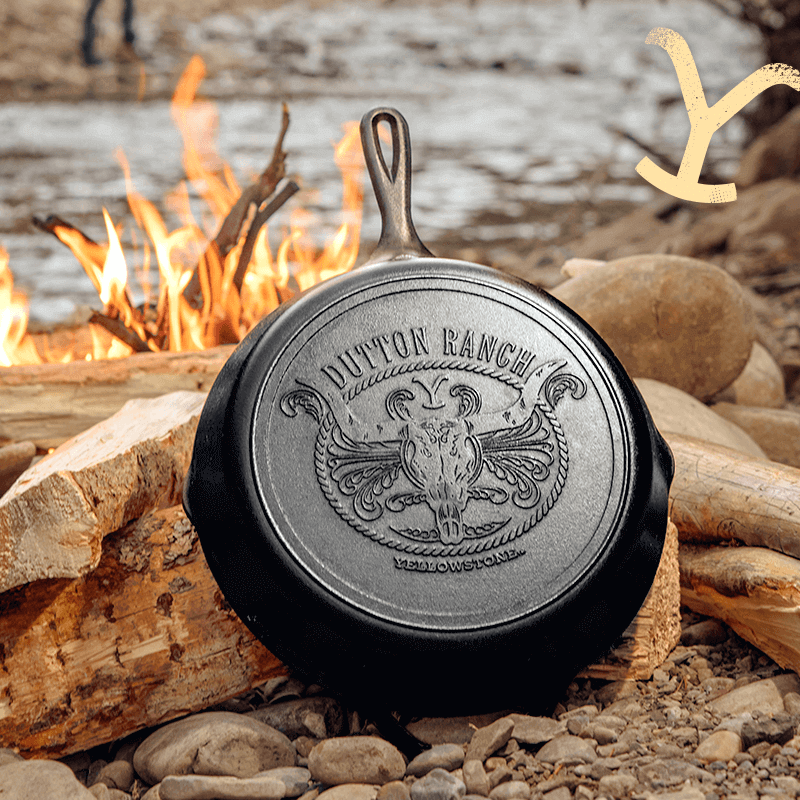 Lodge Yellowstone Cast Iron Steer Skillet with Dutton Ranch design, available at Cabin Depot, perfect for adventurous cooking.