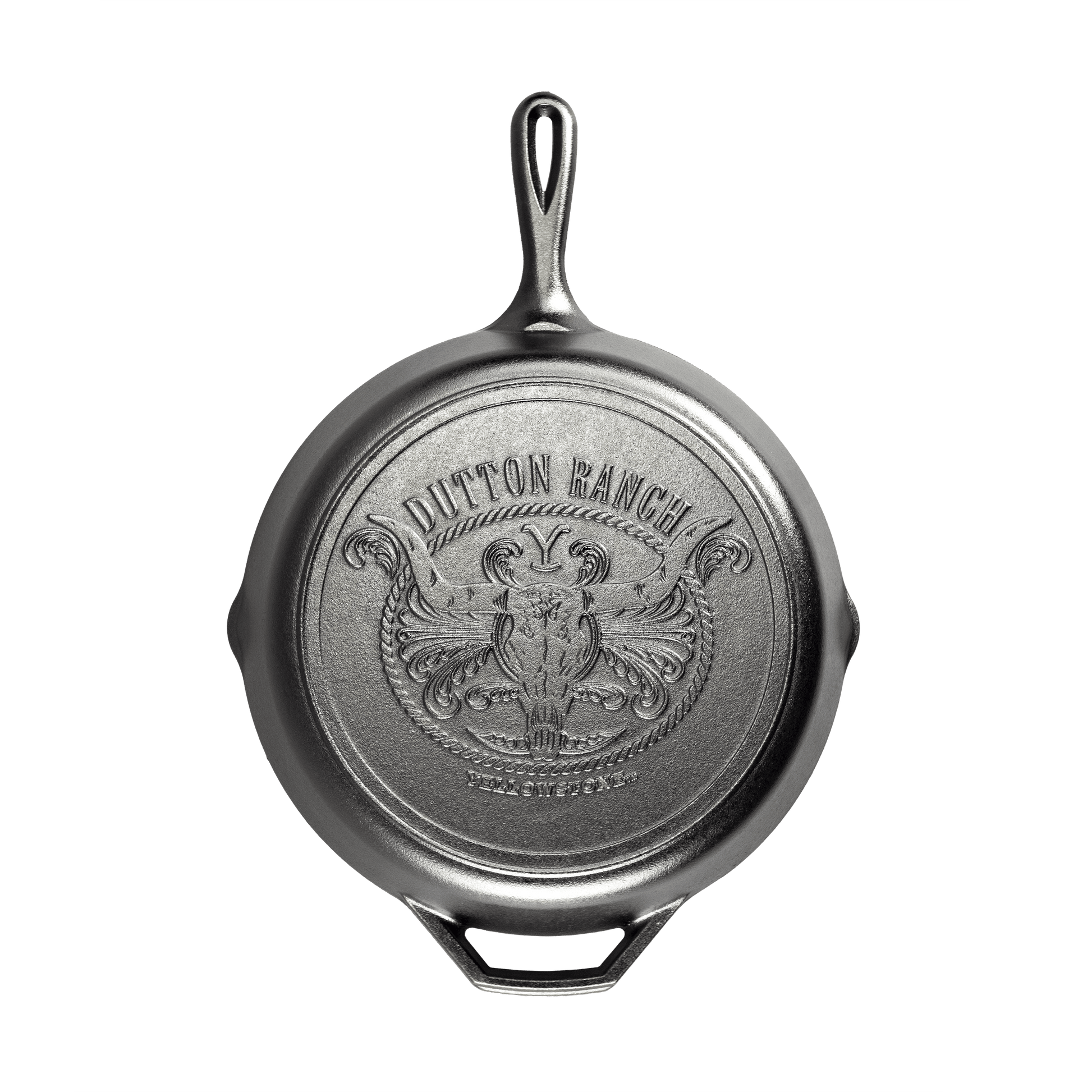 Lodge 12-inch Yellowstone cast iron steer skillet with Dutton Ranch design, available at Cabin Depot, ideal for rustic cooking and gifting.