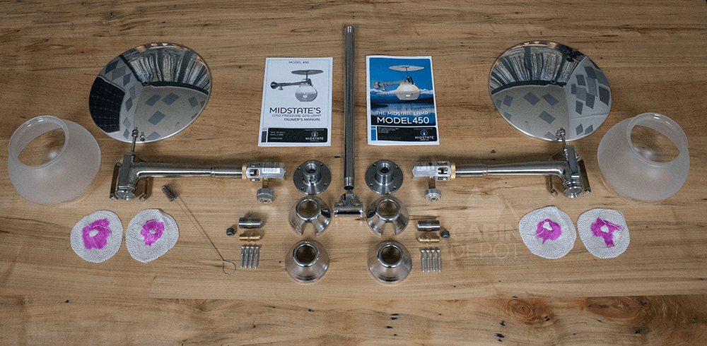 Components of Midstate Model 450 Propane Lamp with manuals and mounting parts on display.