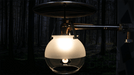 Midstate Model 450 double ceiling mount propane lamp glowing in the dark forest.