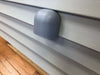 Nature's Head Shell Vent installed on exterior wall, showcasing sleek design for cabins, homes, RVs, and more.