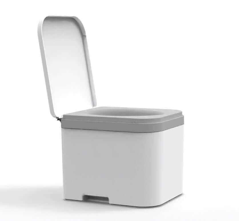 OGO Nomad compost toilet for cabins, featuring urine diversion and snap-in bag. Available at Cabin Depot, modern design.