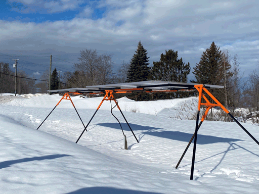 Trifecta 6-Panel Ground Mount Kit from Cabin Depot installed in snowy landscape, showcasing durable steel construction for solar panels.