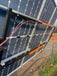 Solar panels mounted on a Trifecta Ground Mount Panel Adapter Kit for optimal energy production.