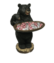 Bear holding wood dish serving tray by Rivers Edge, ideal for cabin décor. Features candy, suitable for nuts, from Cabin Depot.