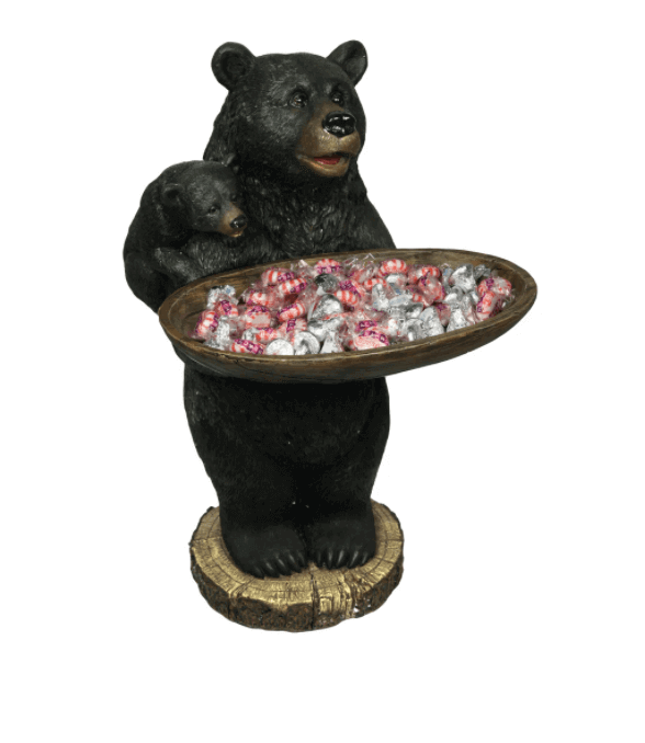 Bear holding wood dish serving tray by Rivers Edge, ideal for cabin décor. Features candy, suitable for nuts, from Cabin Depot.