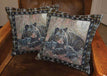 "Rivers Edge 18-Inch Bear Tapestry Pillow 2 Pack featuring bear design on a chair, perfect for home or cabin decor."