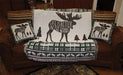 Moose-themed tapestry throw and pillow set on brown sofa with rustic decor.