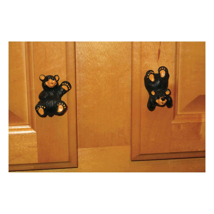 Rivers Edge Black Bear Drawer Cabinet Knobs on wooden cabinet doors, showcasing hand-painted bear-themed home decor.