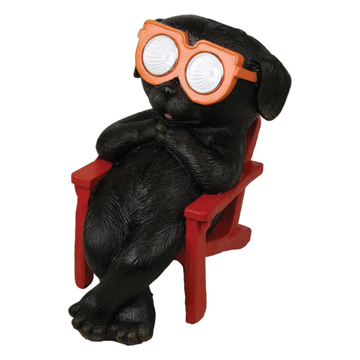 Black Lab solar garden light sitting in a chair, wearing sunglasses, hand-painted poly resin for indoor or outdoor use.