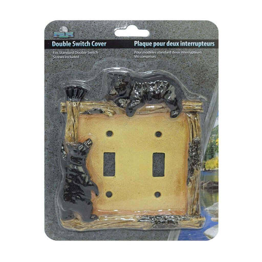 Rivers Edge Bear Double Switch Plate Cover with wood border and black bear decoration in packaging.