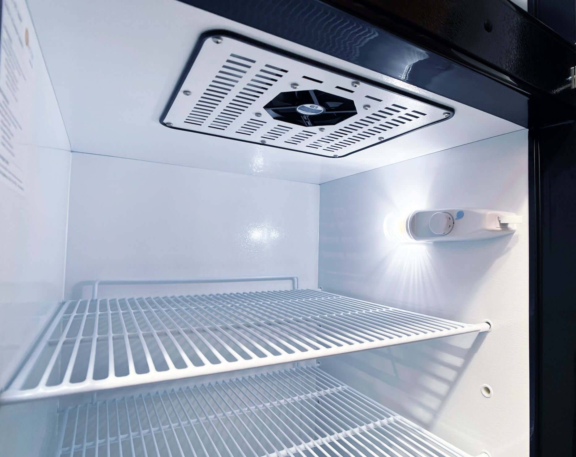 Interior view of SunStar 16CU Solar/DC Refrigerator with stainless steel design, featuring dual compressor cooling, available at Cabin Depot.