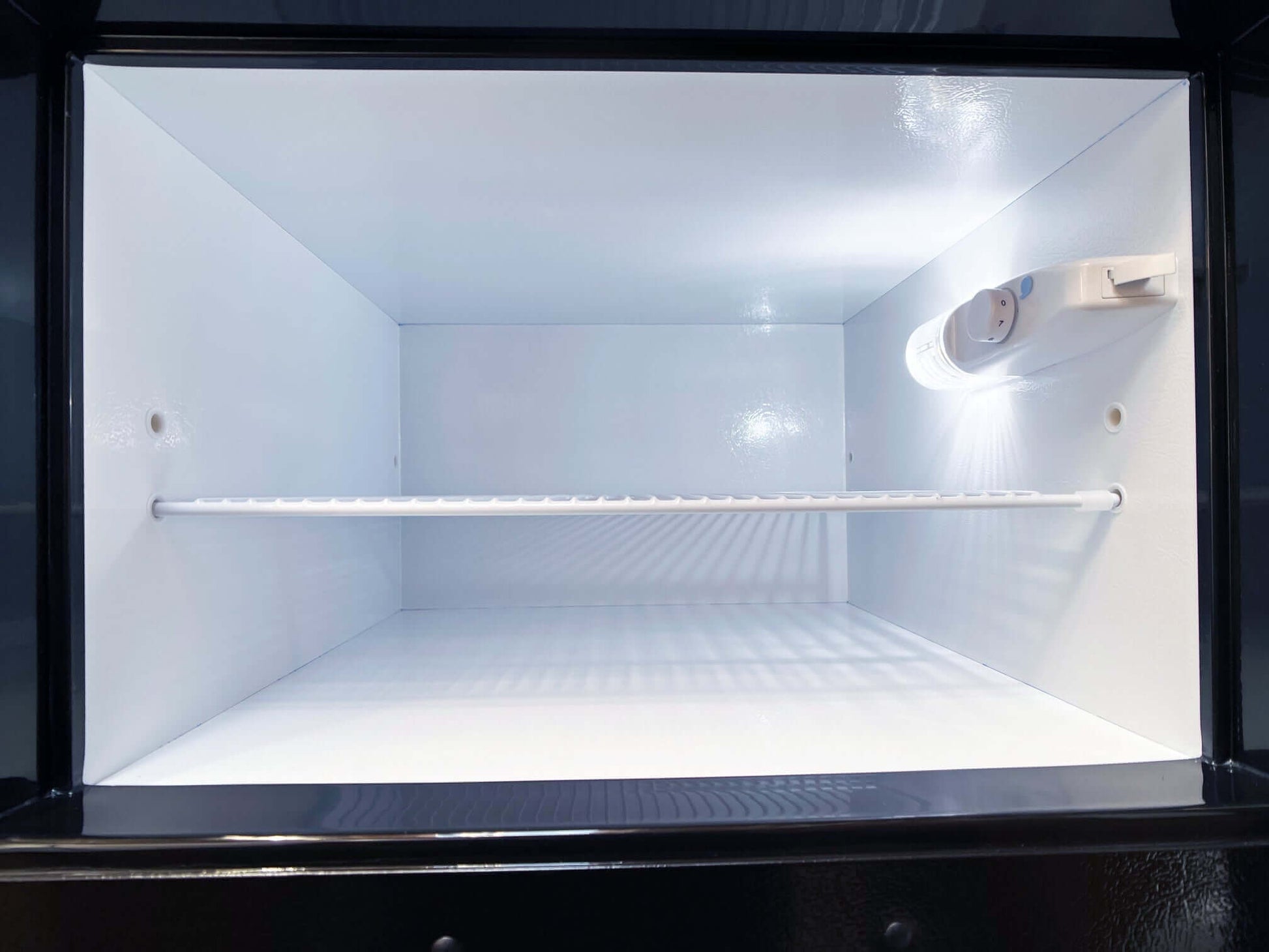 SunStar 16CU Solar/DC Refrigerator interior view with stainless steel design, ideal for off-grid use. Available at Cabin Depot.