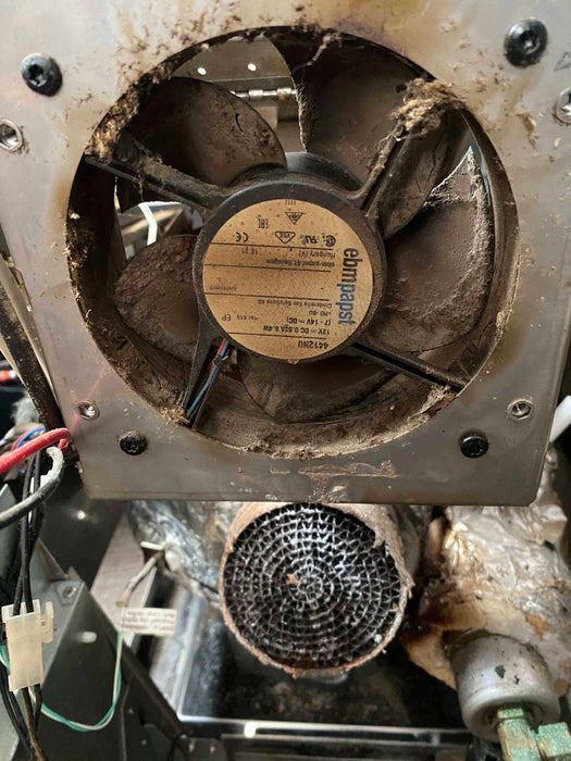 Dirty fan and motor of a Cinderella unit before servicing at The Cabin Depot™.