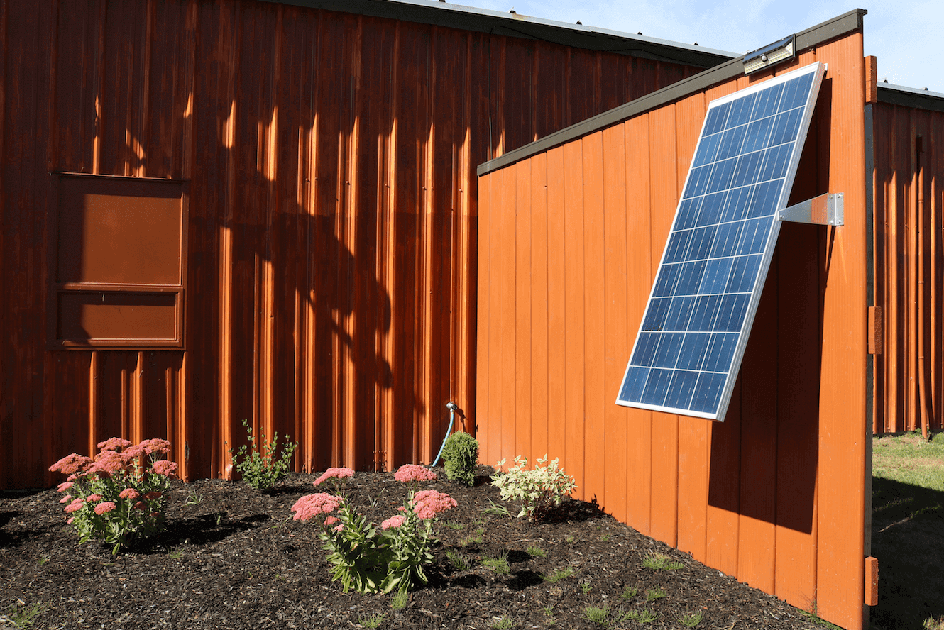 Solar panel mounted at an angle using Kedron 16" Bracket, ideal for wall installation. Available at Cabin Depot. SCREWS NOT INCLUDED.