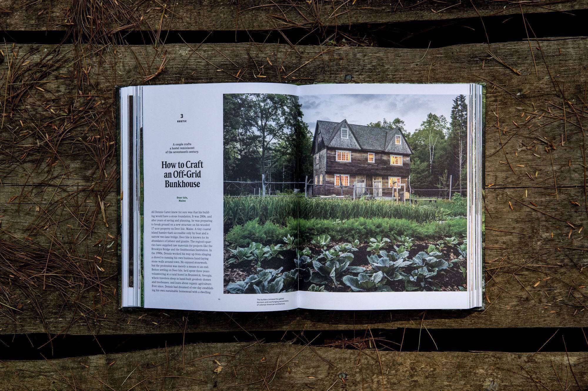 Open Cabin Porn book displaying an off-grid farmhouse amidst nature, part of Cabin Depot’s rural escape collection.