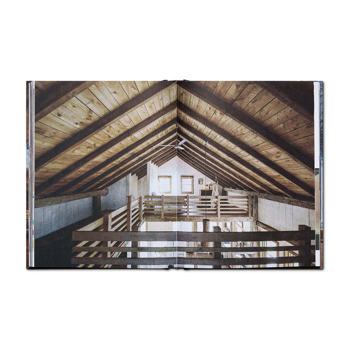 Rustic cabin interior with wooden beams from Cabin Porn Inside Book