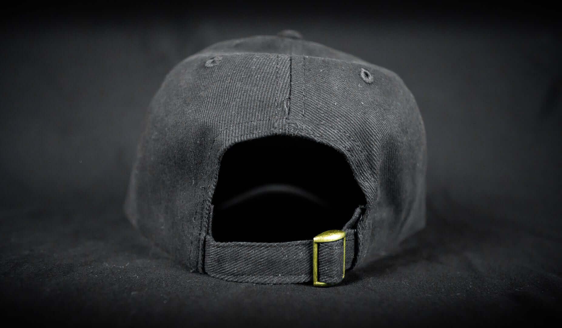 Back view of The Cabin Depot Hat in black with adjustable strap, featuring one-size-fits-all design.
