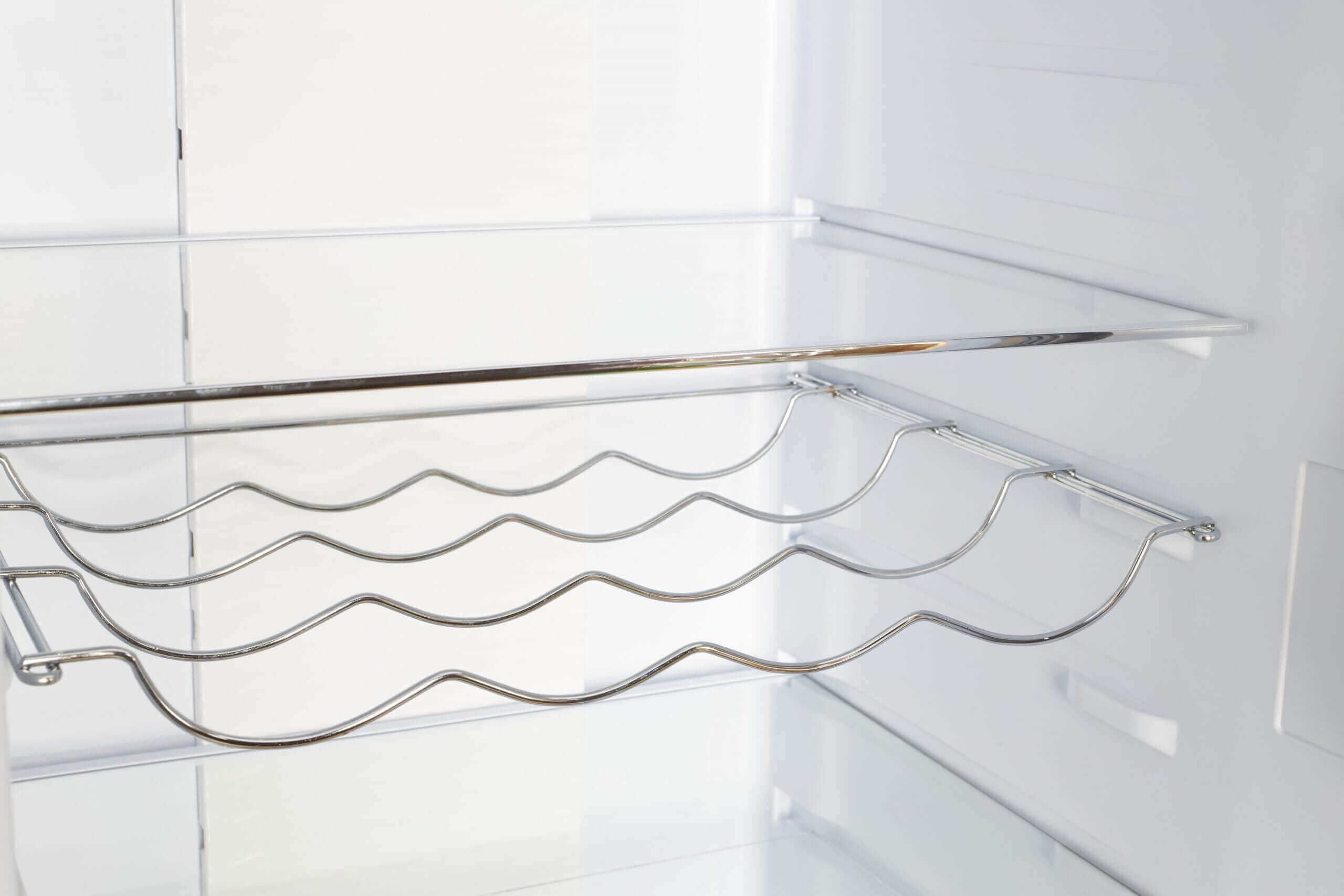 Interior view of Unique 12 Cu/Ft Classic Retro Electric Refrigerator's wine rack, available at Cabin Depot with ample storage space.