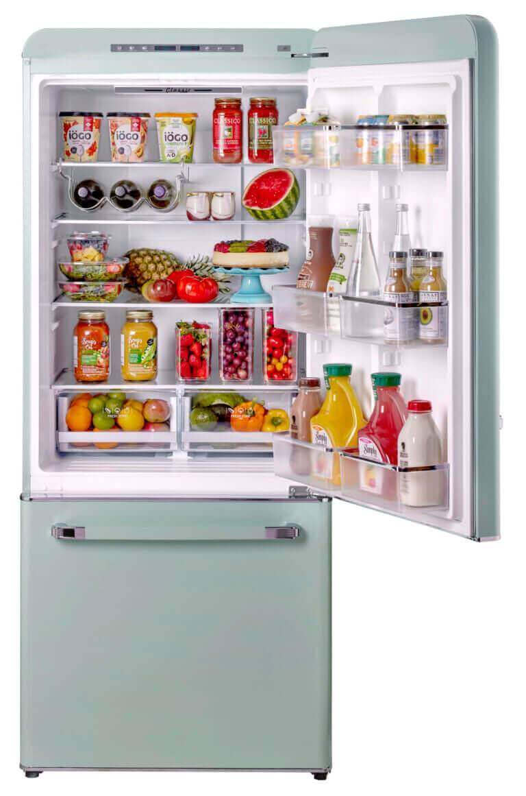 Unique 120V 18 Cu/Ft Classic Retro Bottom Mount Refrigerator in White from Cabin Depot with open door showing food storage.