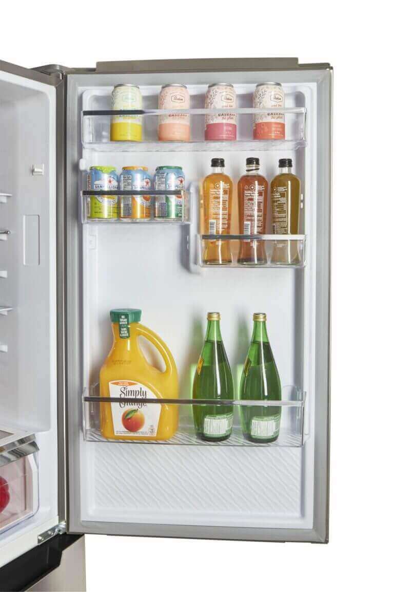 Open door of Prestige Electric Bottom Mount Refrigerator showcasing beverage storage by Cabin Depot.