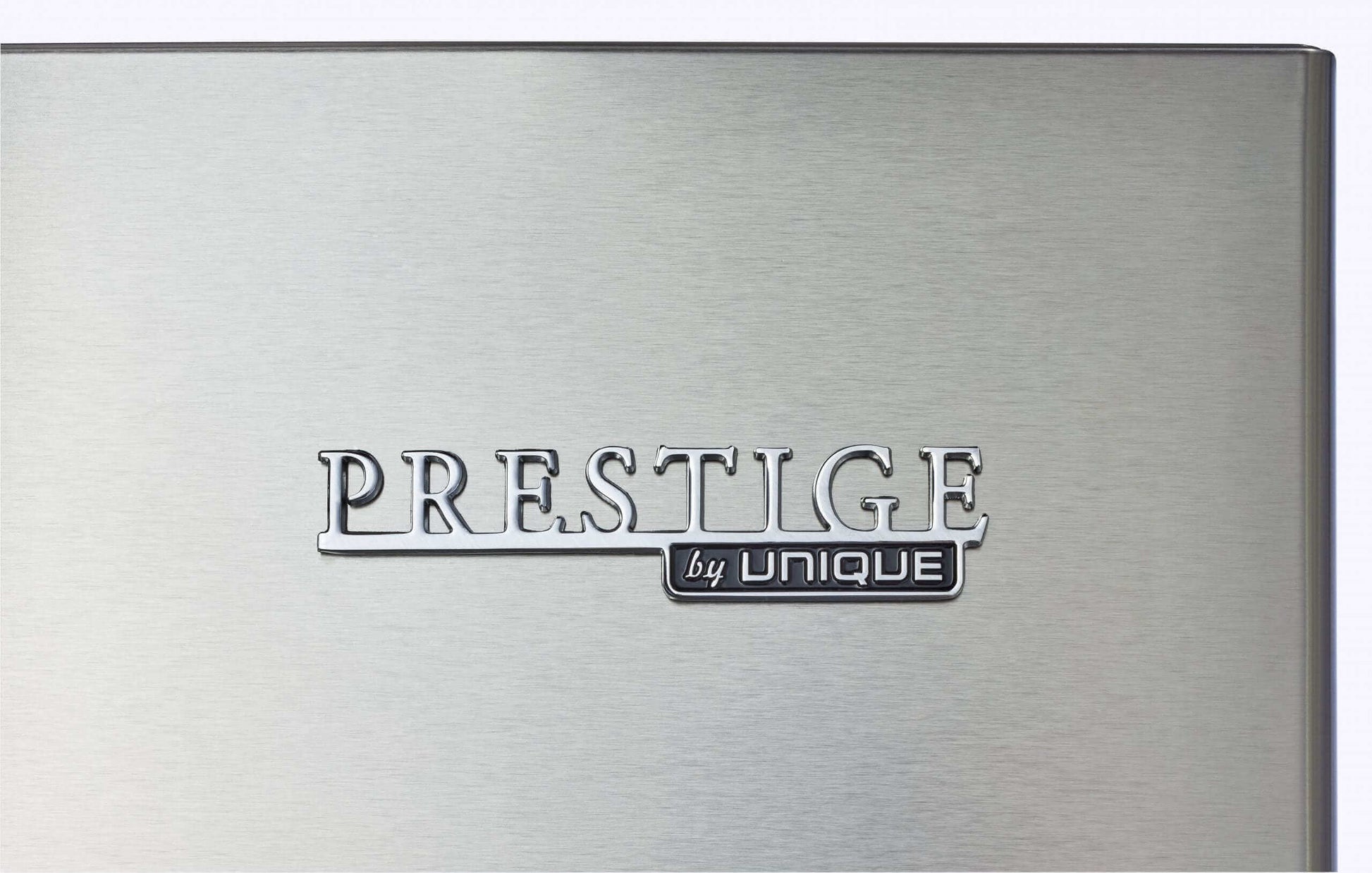 Logo of Prestige by Unique on stainless steel refrigerator at Cabin Depot.