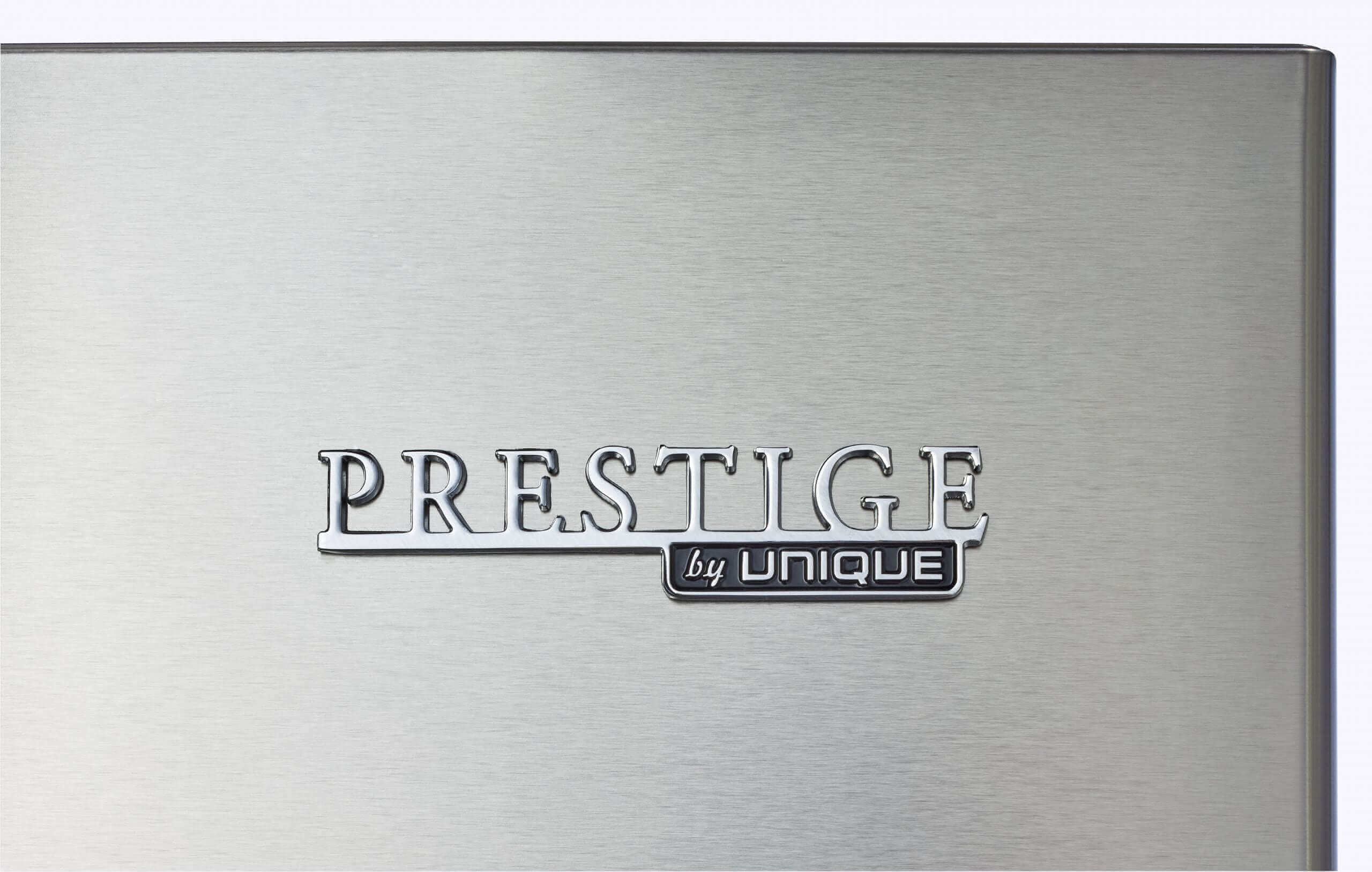 Logo of Prestige by Unique on stainless steel refrigerator at Cabin Depot.