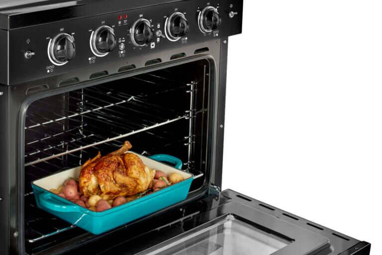 Retro Electric Range with convection oven cooking chicken, available at Cabin Depot.