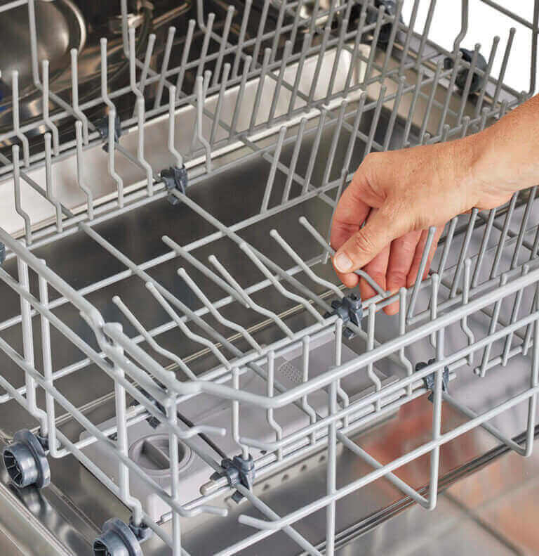 Person adjusting rack in Unique 24" Classic Retro Dishwasher from Cabin Depot