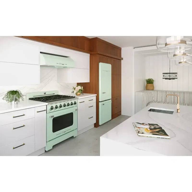 Modern kitchen with Unique 36" Classic Retro Range Hood in mint green from Cabin Depot, featuring chrome accents and retro design.