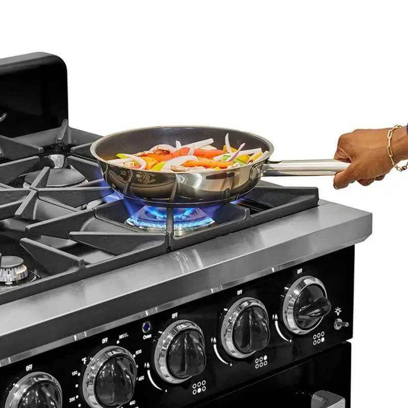 Cooking on Unique 36" Classic Retro Gas Range with skillet, showcasing convection feature, available at Cabin Depot.