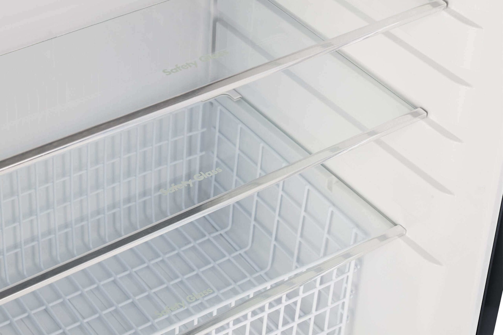 Interior view of Unique 14 CU/FT Propane Refrigerator shelves, ideal for efficient storage. Available at Cabin Depot.