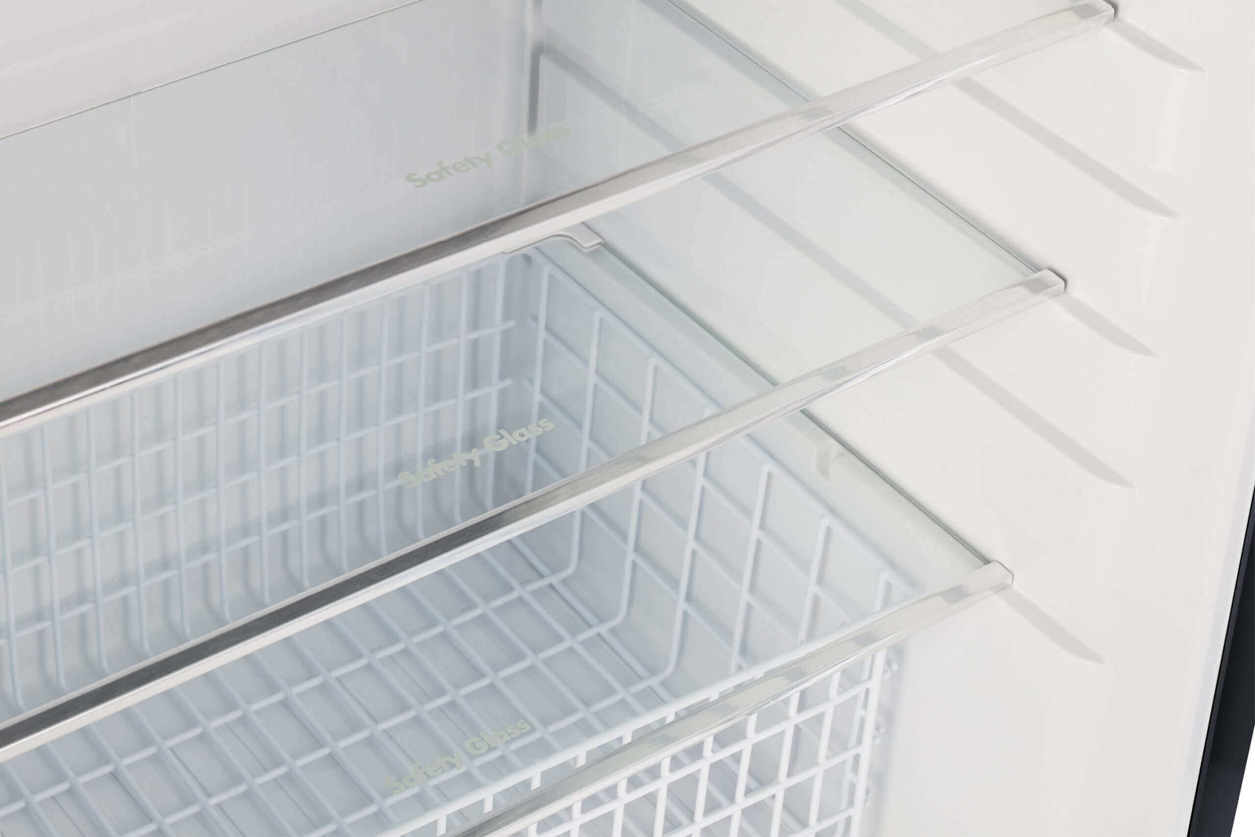 Interior view of Unique 14 CU/FT Propane Refrigerator shelves, ideal for efficient storage. Available at Cabin Depot.