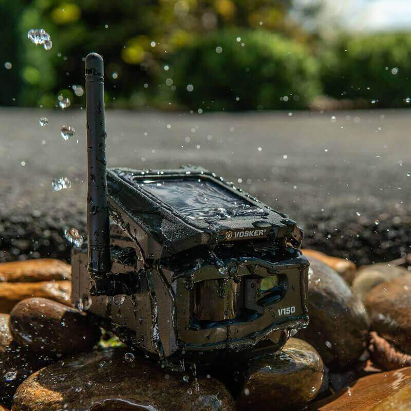 Vosker V150 Solar LTE Cellular Security Camera in nature, highlighting water resistance, by Cabin Depot.