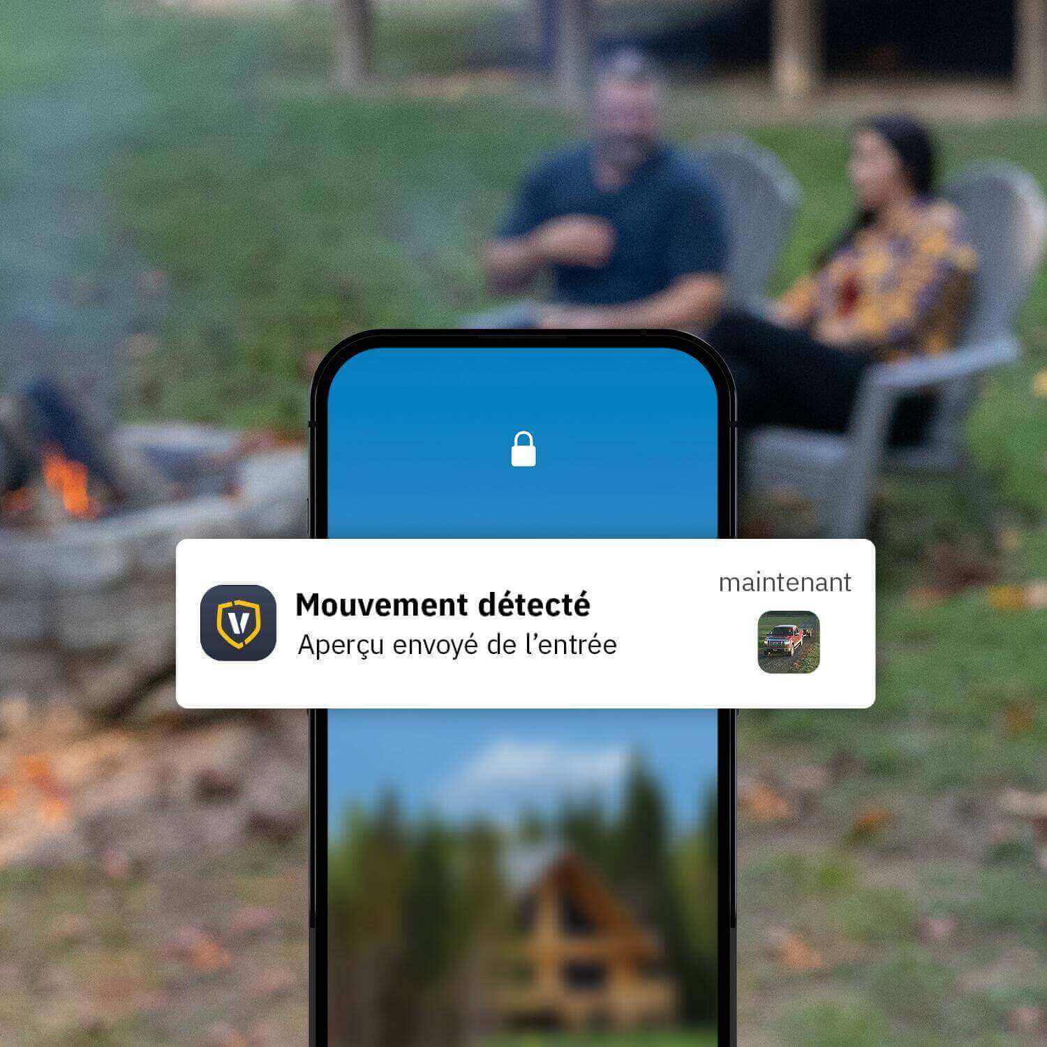 Smartphone displaying Vosker V300 security camera alert for movement detection near cabin, featuring live view functionality.