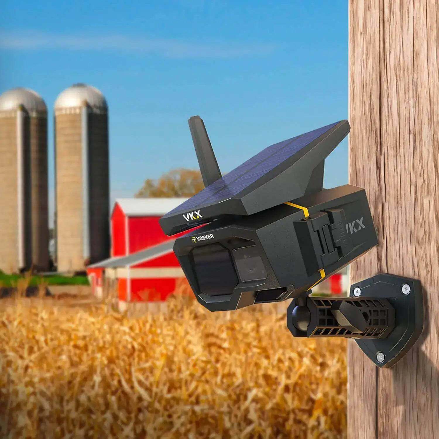 Vosker VKX-CA Cellular Security Camera with solar panel mounted on barn, powered by 4G-LTE, available at Cabin Depot.