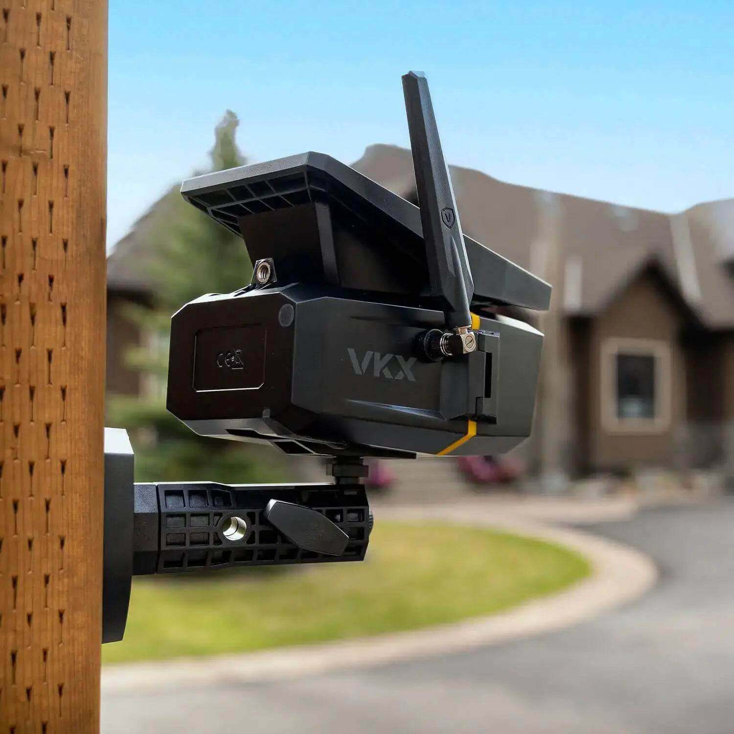Vosker VKX-CA solar powered 4G-LTE camera mounted outside a cabin, featuring easy installation and large solar panel, available at Cabin Depot.