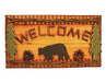 Handcrafted wooden "Welcome" camp sign with a bear silhouette, pinecones, and trees, measuring 18 inches wide by 10.5 inches tall.