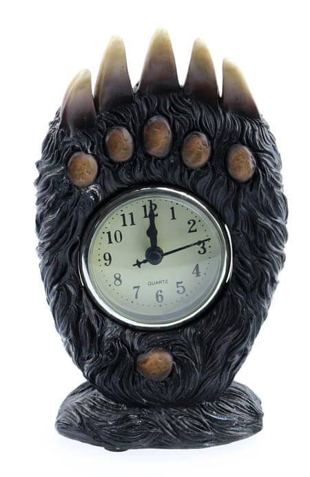 Unique bear paw-shaped clock with rustic design, featuring a quartz clock face, measuring 4" x 2.25" x 7.5".