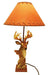 Handcrafted deer lamp with hyde shade, 20" tall, perfect for cozy reading light and soft ambiance.