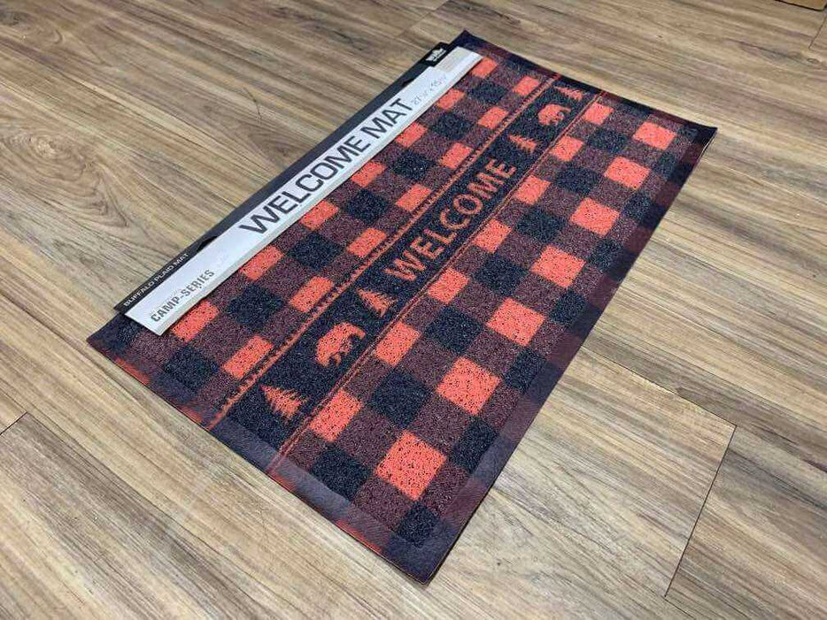 Buffalo plaid bear welcome floor mat, 15.75"x27.5", rustic design on wooden floor.