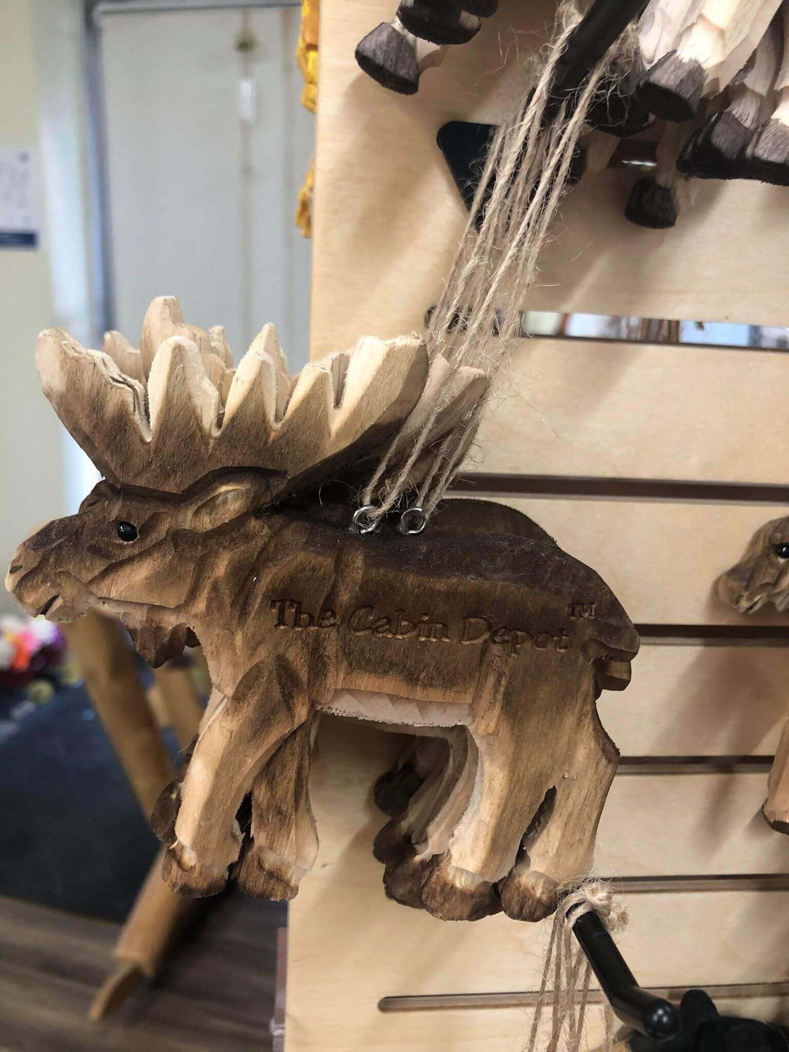 Handcrafted NWL wooden moose ornament from The Cabin Depot, showcasing rustic cabin decor. Perfect for nature-inspired home design.