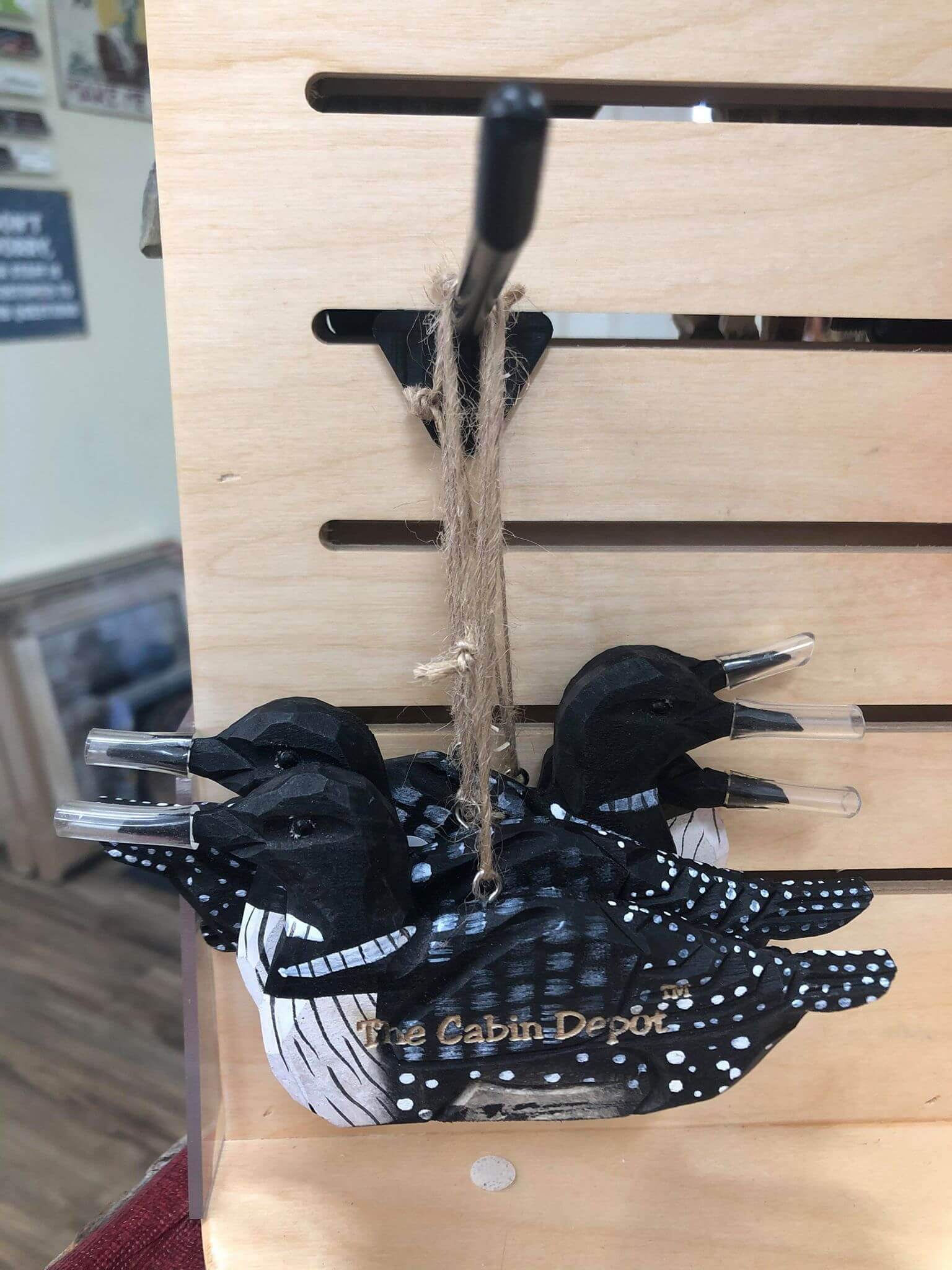 Hand-crafted wooden loon ornament from The Cabin Depot, showcasing artisanal woodwork and rustic charm. Perfect cabin decor gift.
