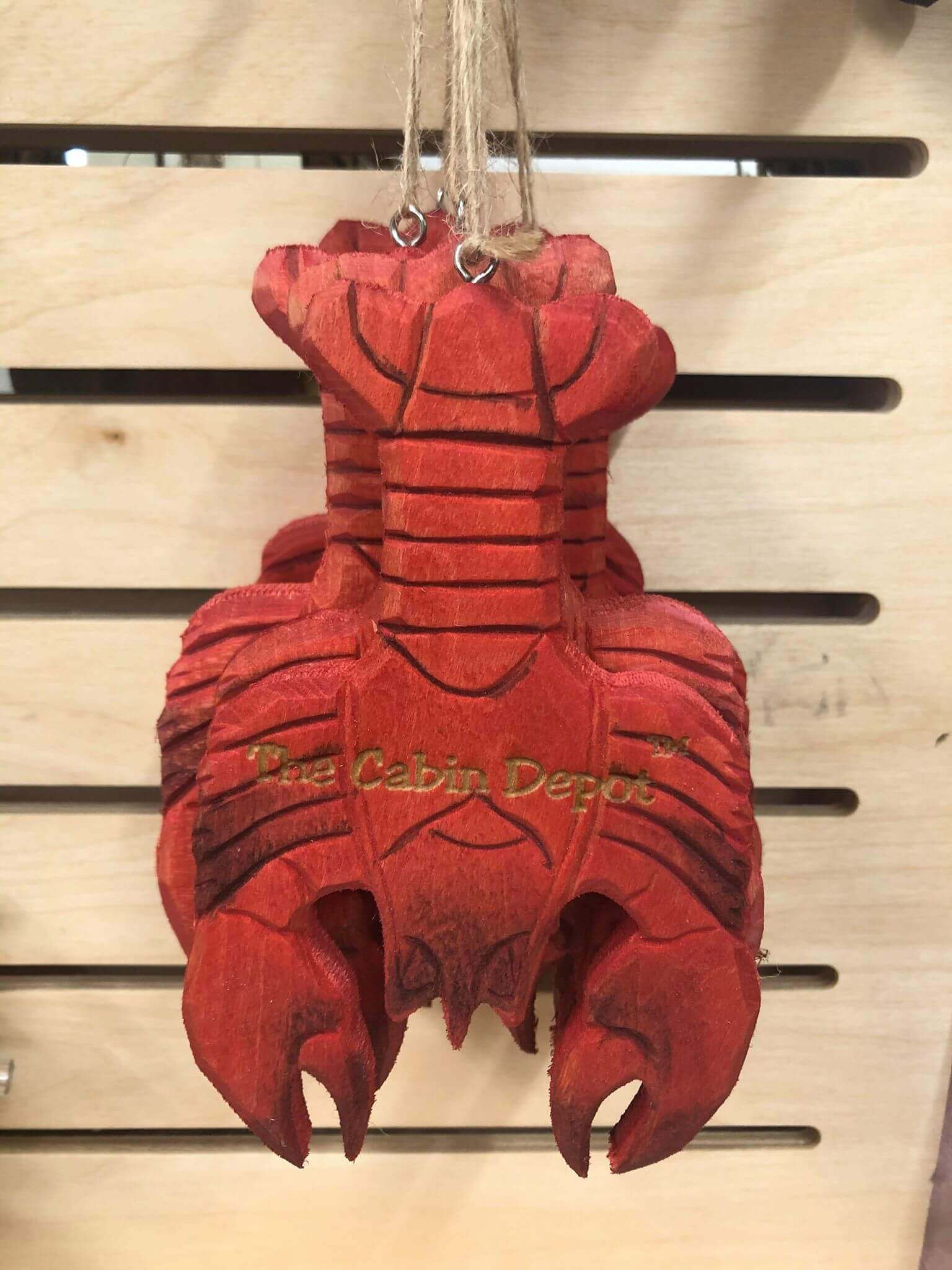 Handcrafted NWL Wooden Lobster Ornament from The Cabin Depot, perfect for rustic décor and gifting.